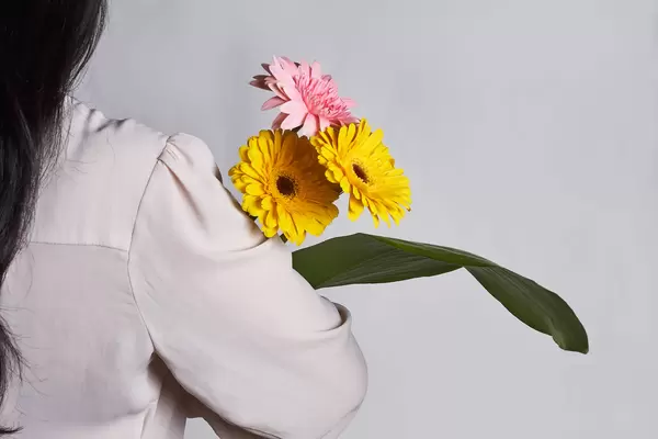 10. Young woman holds a beautiful bouquet of spring flowers.jpg