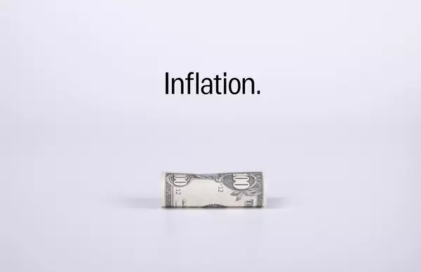 100 dollar banknote with Inflation text on white background