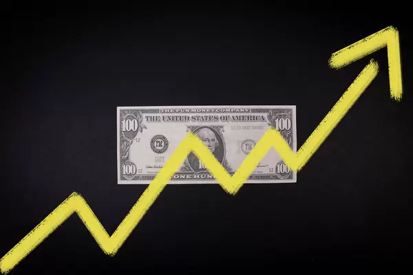 100 Dollar banknote with yellow up chart