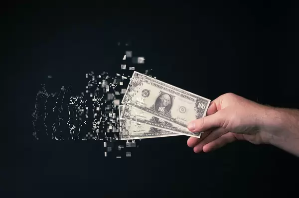 100 dollar bills tearing apart