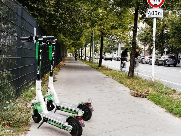 2 lime e-scooters parked on the street of Berlin.jpg