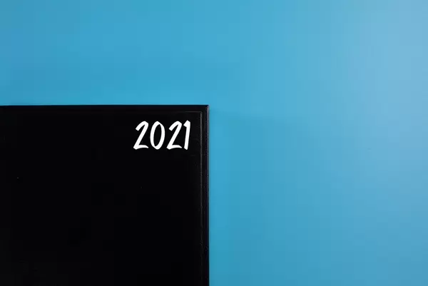 2021 written on a cover of a black book