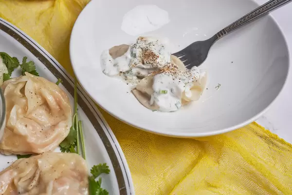 24. The concept of oriental cuisine. Uzbek food Manti or manty dumplings restaurant concept.jpg