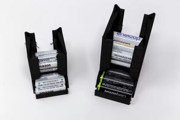 3D printed Black battery holder and dispenser with rechargeable Amazon batteries