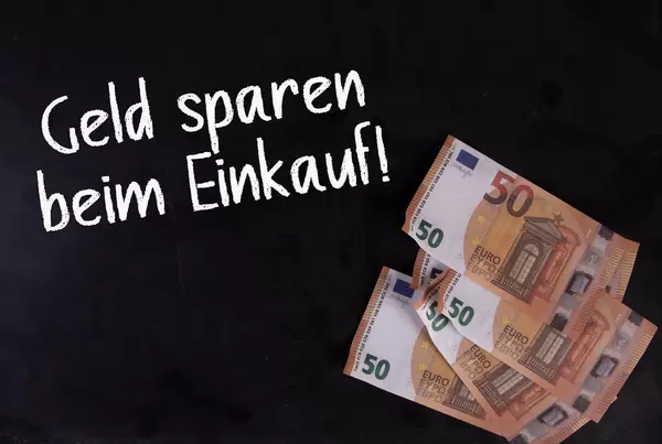 50 Euro banknotes with Geld Sparen beim Einkauf text