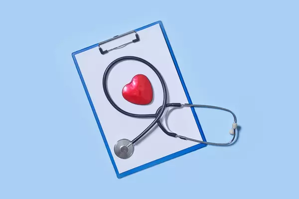 8. Stethoscope and heart on blue background