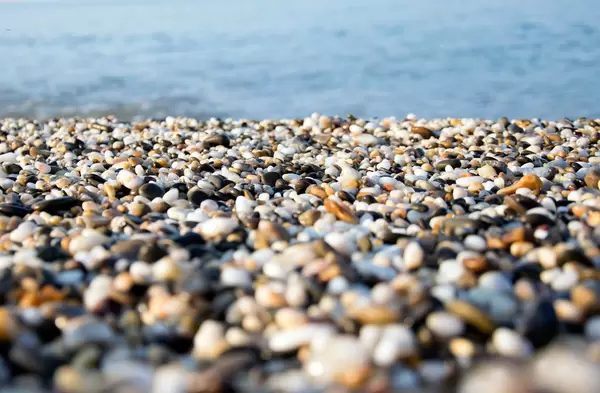 A beach of colourful pebbles at the shore of Black Sea, in Evpatoriya, Crimea