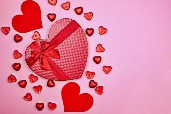 A big heart-shape candy box on red
