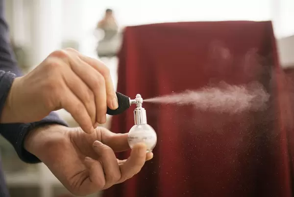 A body and face glitter shimmer spray