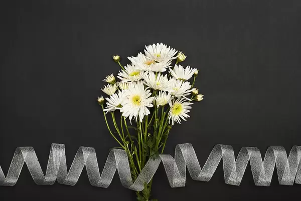 A bouquet of beautiful white flowers with ribbon
