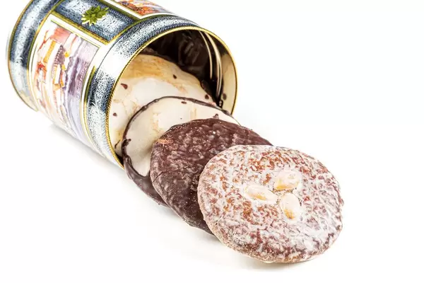 A box with different gingerbread cookies on a white background