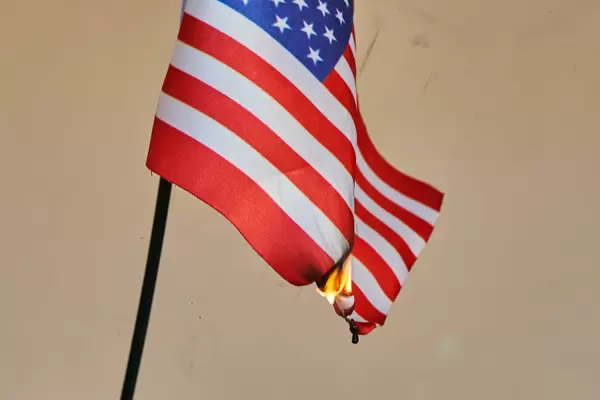 A burning US national flag