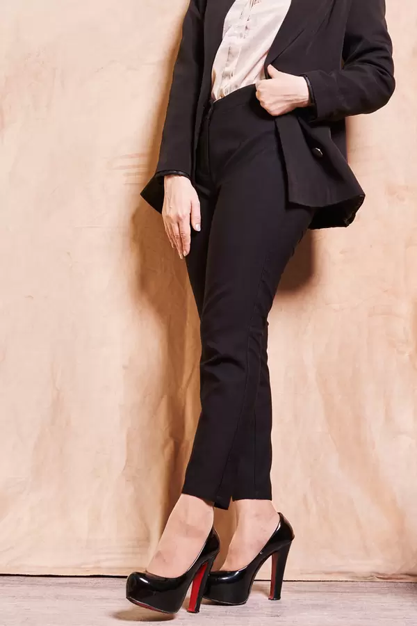 A businesswoman in elegant office clothing