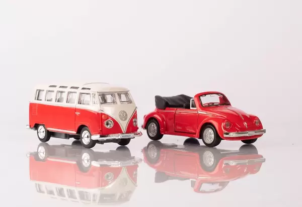 A classic red minibus and red beetle car (Flip 2019)