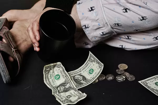 A dirty homeless person begging for money