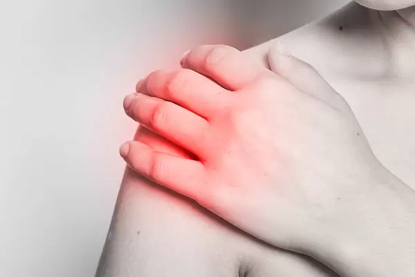 A female with pain in shoulder