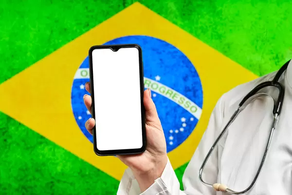 A healthcare worker with a cell phone and blank screen