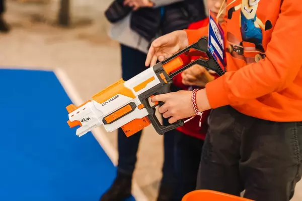 A Kid Holding Toy Nerf Rifle (Flip 2019)