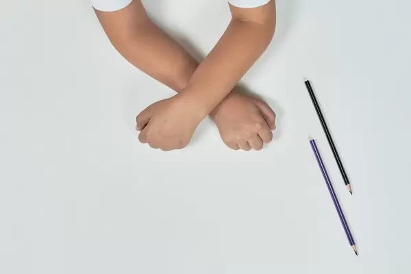 A little kid hands on white background. Top view