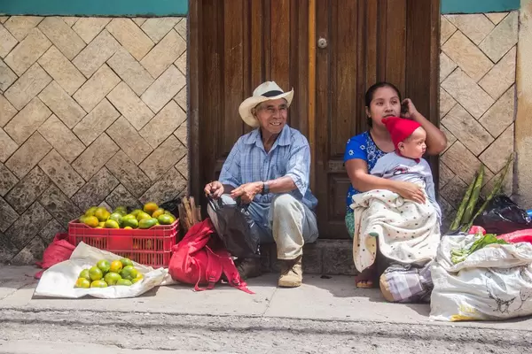 A Man and a Woman Selling Mandarins.