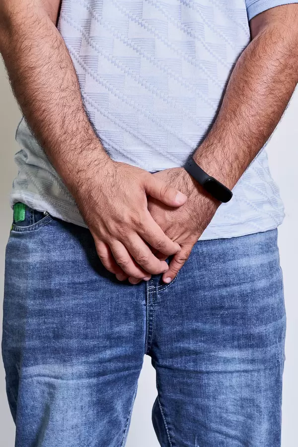 A man holds his groin area. Concept of prostatitis illness