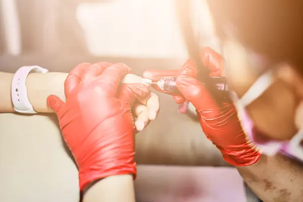 A manicurist making hand nails beautiful