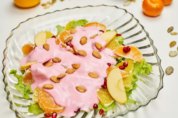 A mix of natural raw fruits with yogurt