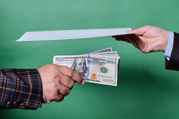 A person offering to sign a contract for a bribe