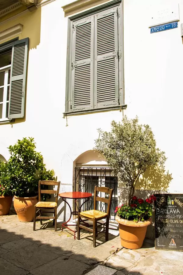 A picturesque corner cafe on a sunny day in Athens, Greece.