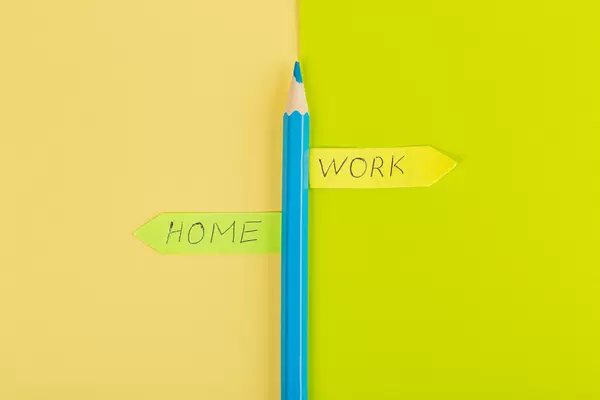 A pointer made of pencil and paper, the concept of choosing between home and work