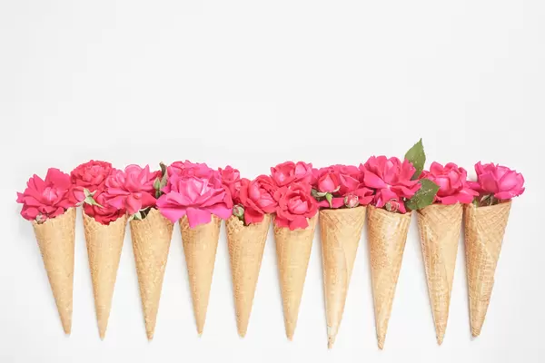 A row of creative flower bouquets with waffle cones