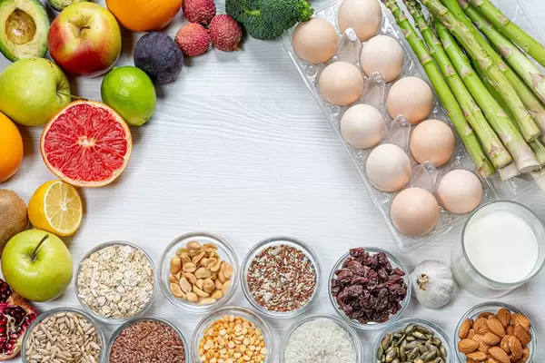 A set of products useful for the brain on a white wooden background with free space. (Flip 2019)