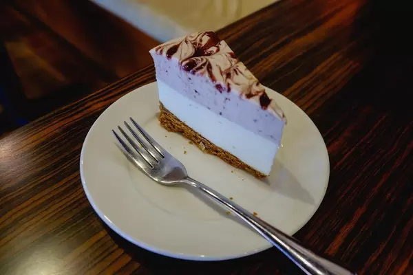 A slice of raspberry cheesecake