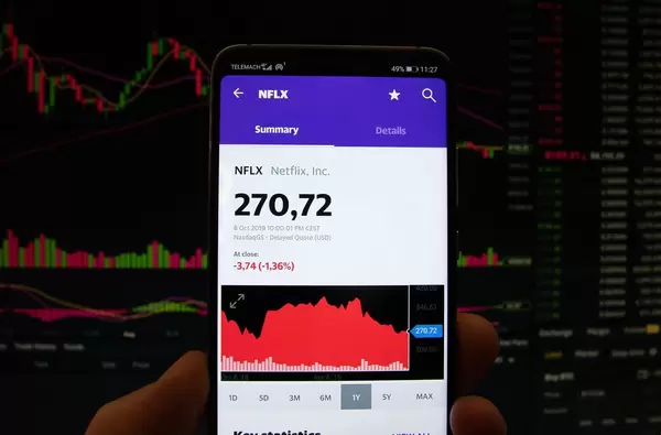 A smartphone displays the Netflix market value