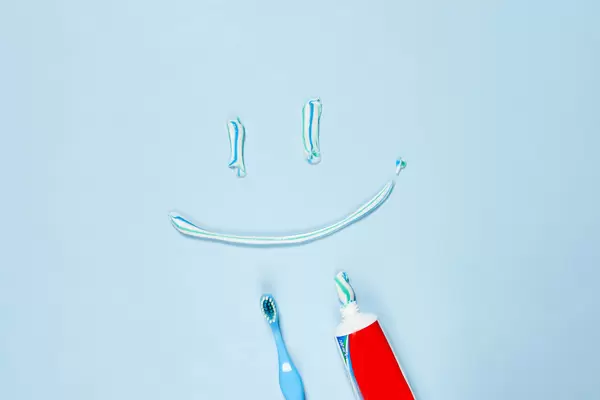 A smile made with paste. Toothpaste and brush