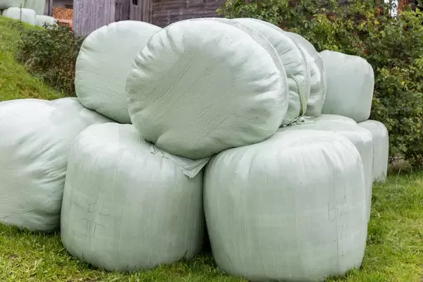 A stack of hay bales stored on a farm in Alpbach, Tyrol, Austria