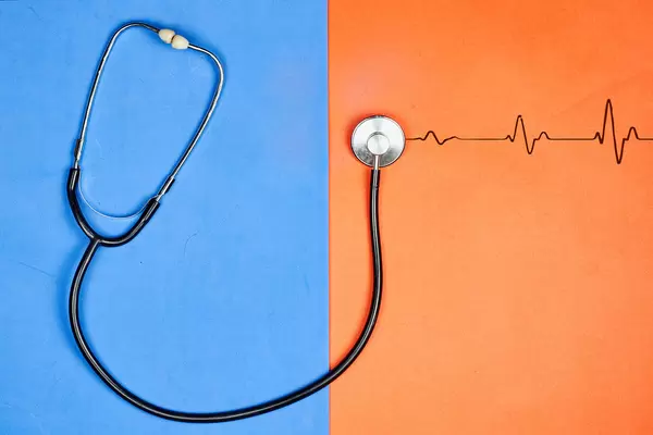 A stethoscope showing listening to a heartbeat