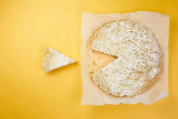 A sweet and big pie like a Pacman eating delicious cake slices on its way