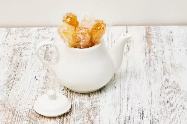 A teapot with sweet candies