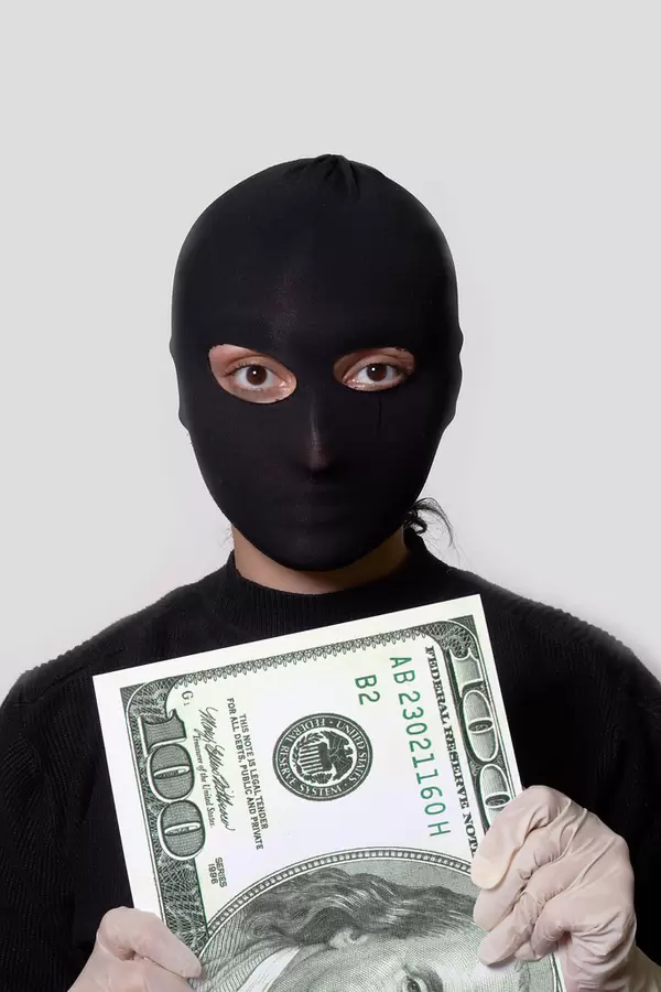 A thief trying to grab money