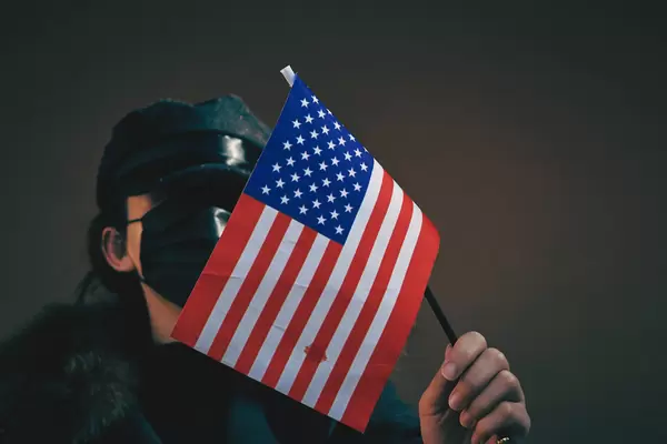 A woman holding american flag