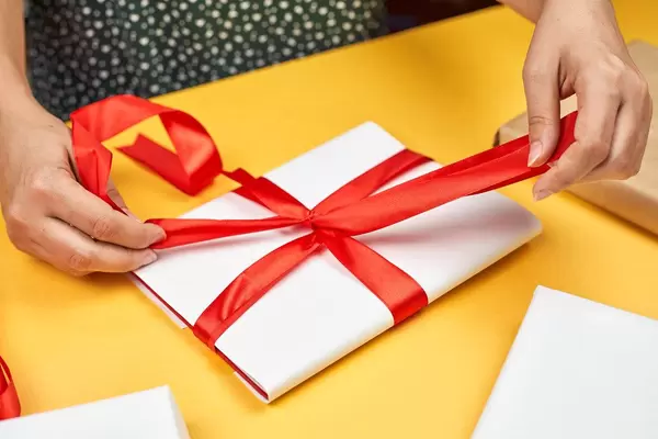 A woman making Christmas gift