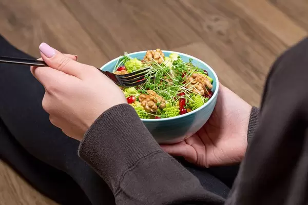 A woman takes care of her figure. Concept of dietary, vegetarian food (Flip 2020)