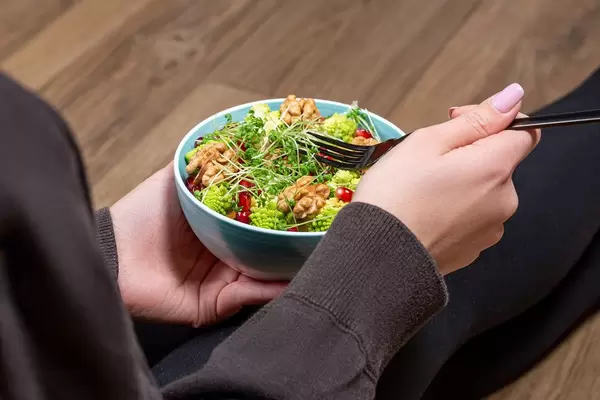 A woman takes care of her figure. Concept of dietary, vegetarian food