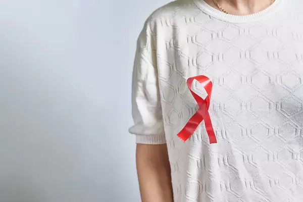 A woman with pink ribbon. Female health check awareness