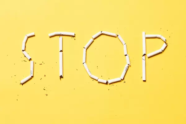 A word 'Stop' made with cigarettes