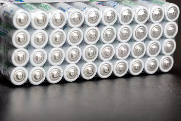 AAA alkaline batteries on a black background