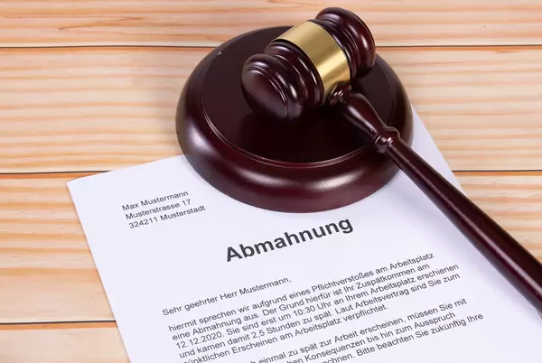 Abmahnung document with a wooden judge gavel