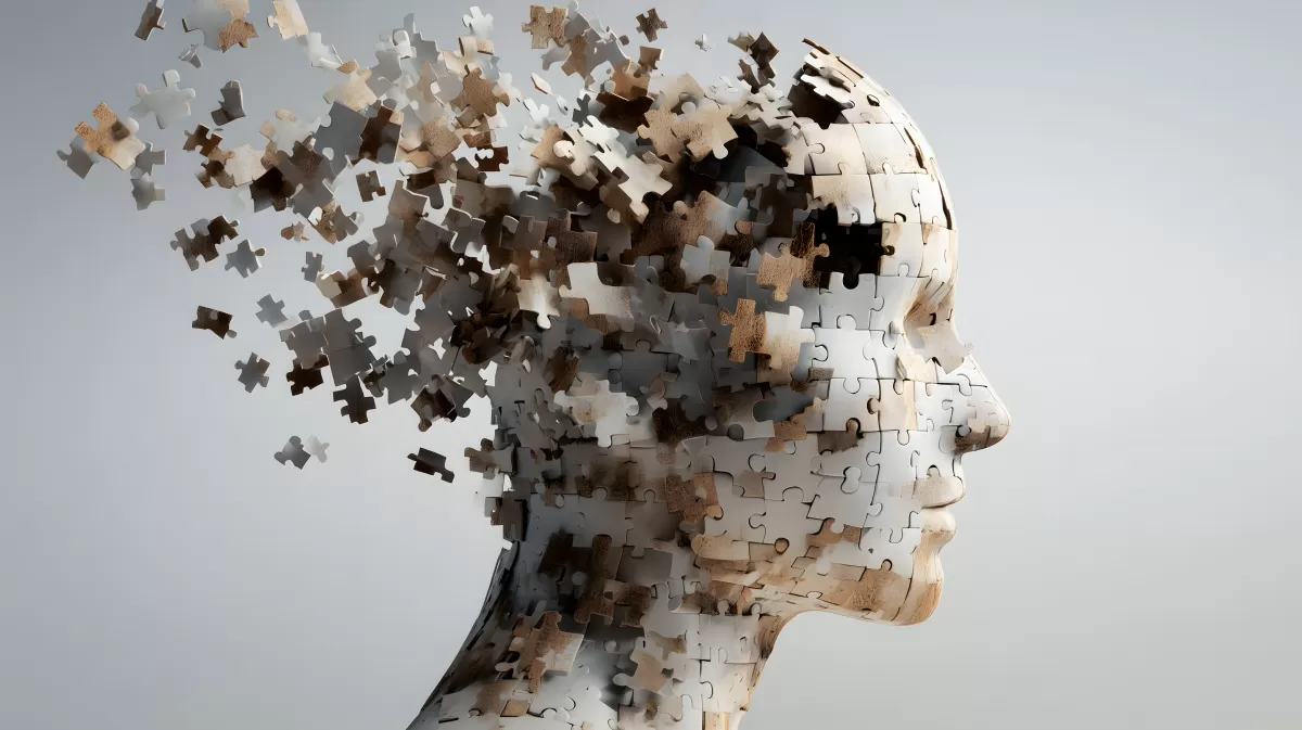 Abstrakte Demenzdarstellung mit zerfallender Kopfform