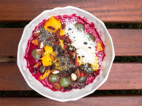 Acai-Bowl of the Day with Almonds, Mango, Chia and Dark Chocolate